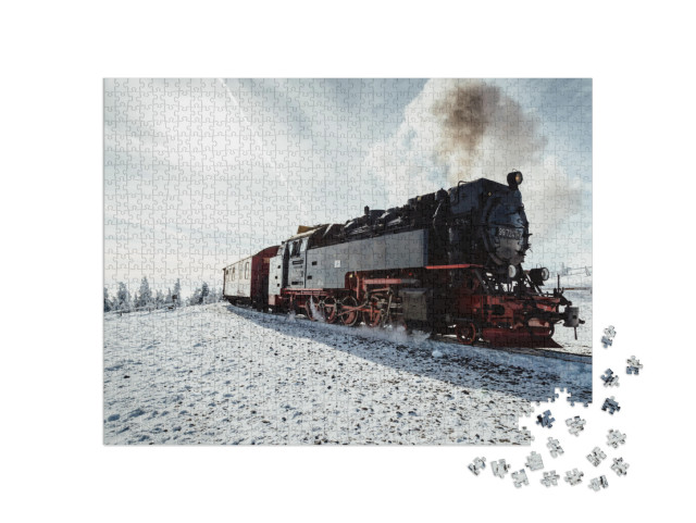 puzzle 1000 dílků „Parní vlak v zimě na Brockenu, Harz“