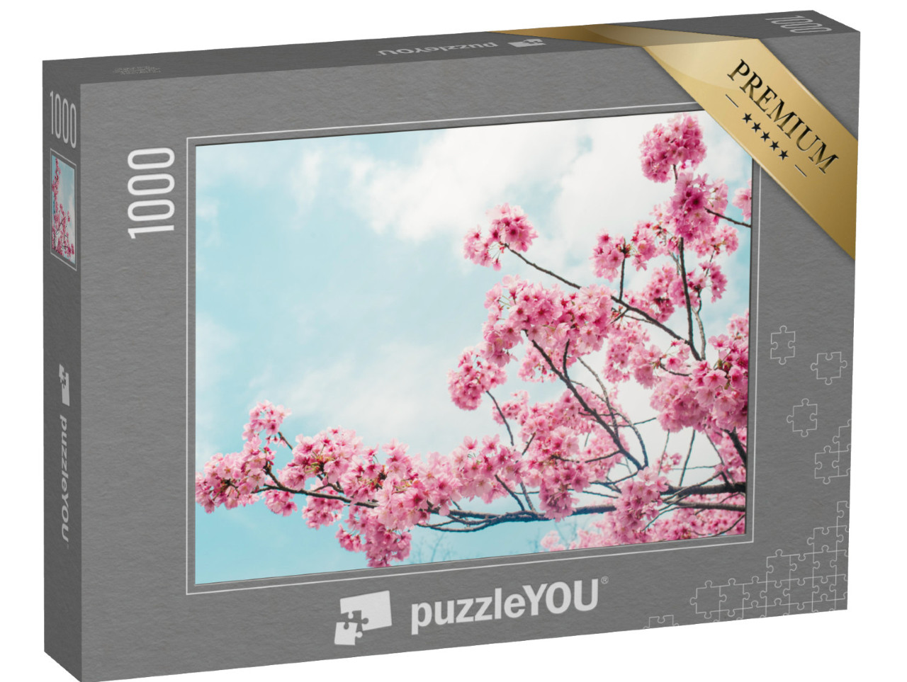 puzzle 1000 dílků „Okouzlující kvetoucí větve třešní pod modrou oblohou“