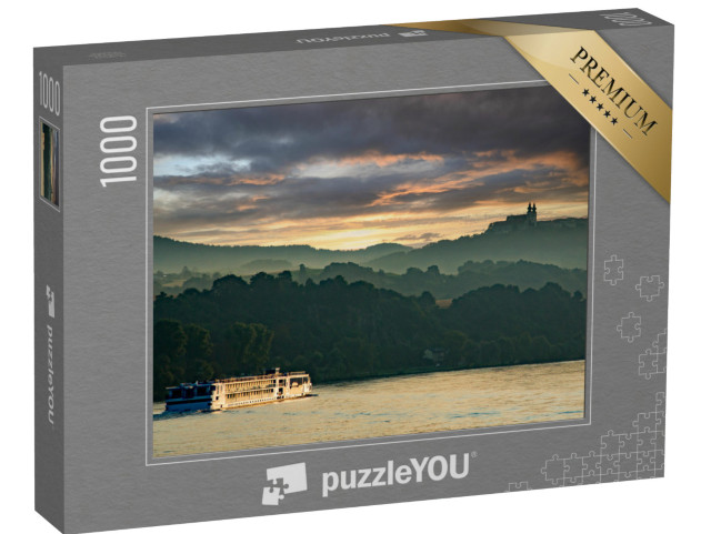 puzzle 1000 dílků „Říční výletní loď na Dunaji při západu slunce, Melk, Dolní Rakousko“