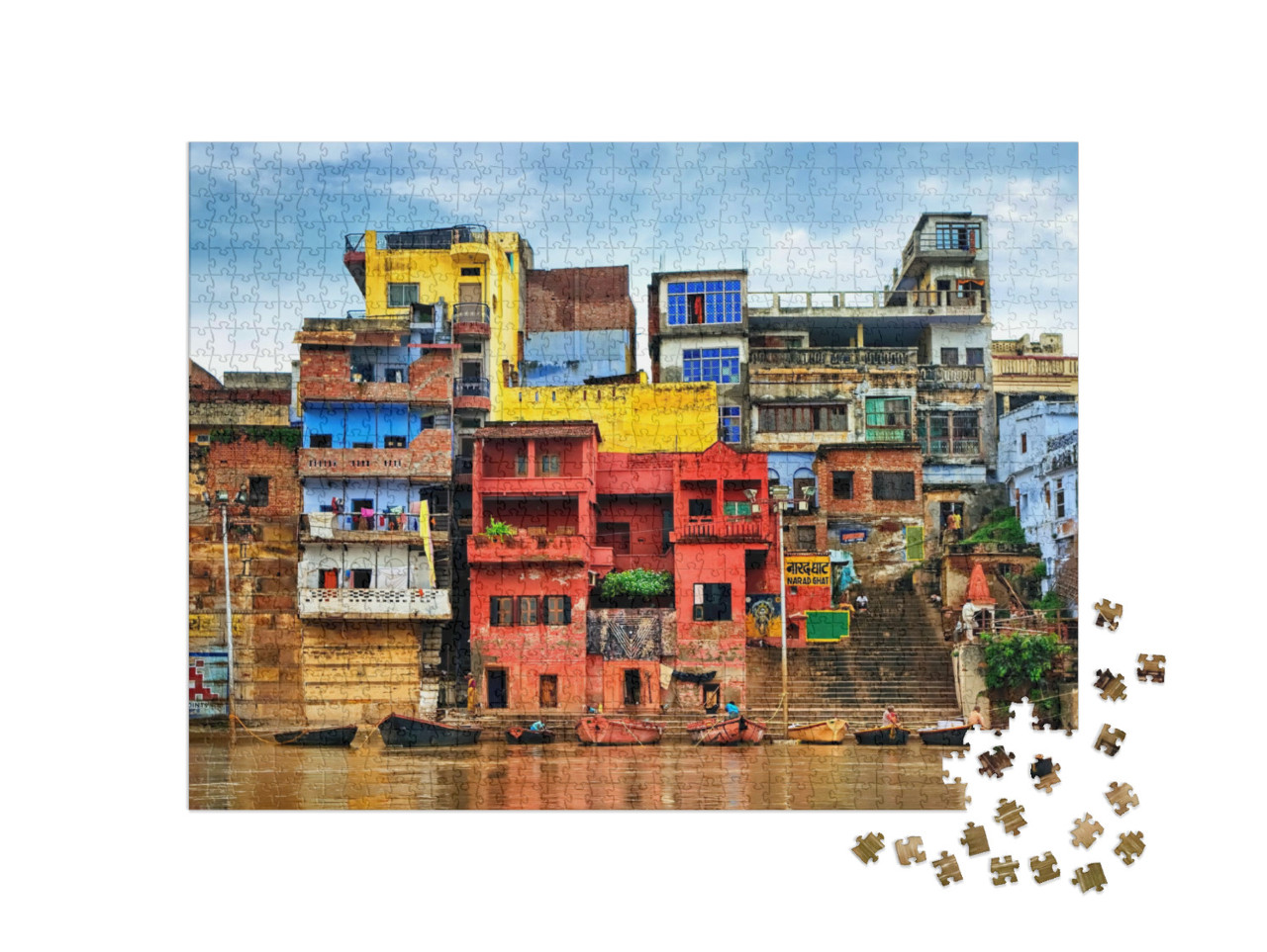 puzzle 1000 dílků „Jako v jiném světě: barevné domy u řeky Gangy, Váránasí, Indie“