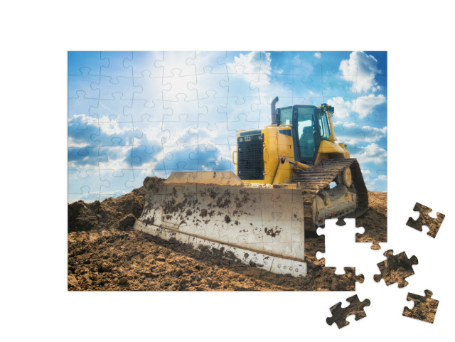 puzzle 100 dílků „Žlutý bagr na nové stavbě“
