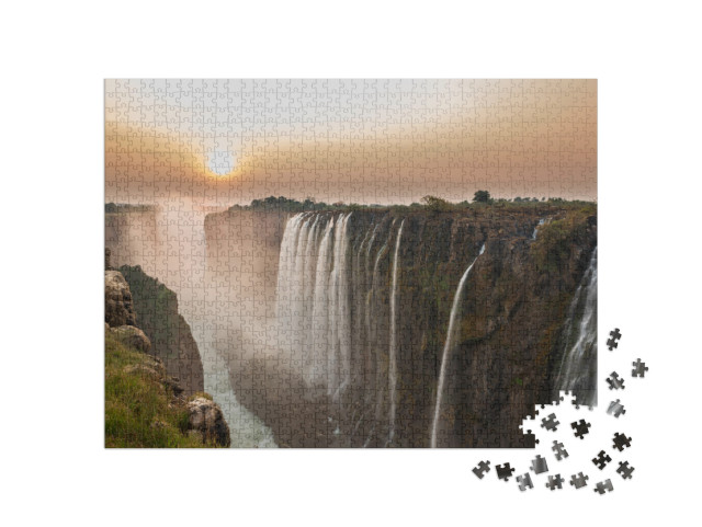 puzzle 1000 dílků „Viktoriiny vodopády při západu slunce, pohled ze Zambie“